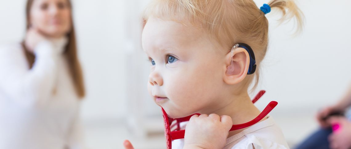 Young girl with hearing aids